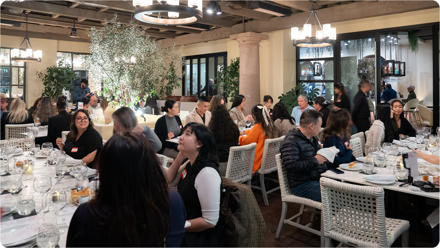 Restaurant dining event with people seated at tables