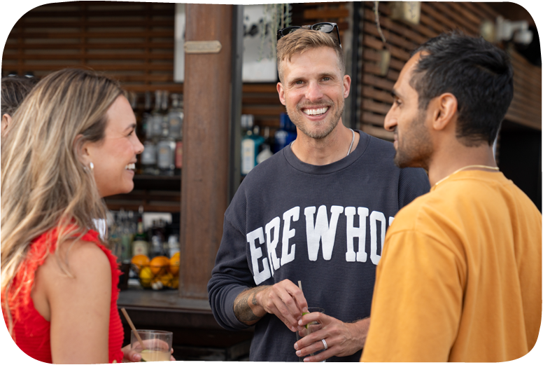 Group of friends talking at a social gathering