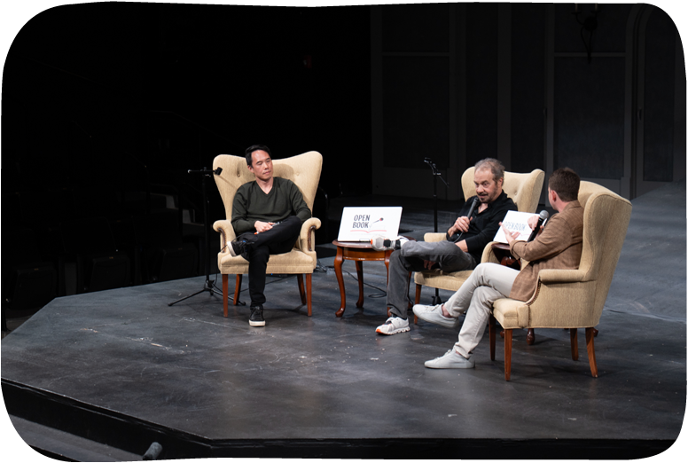 Panel discussion with three speakers in armchairs